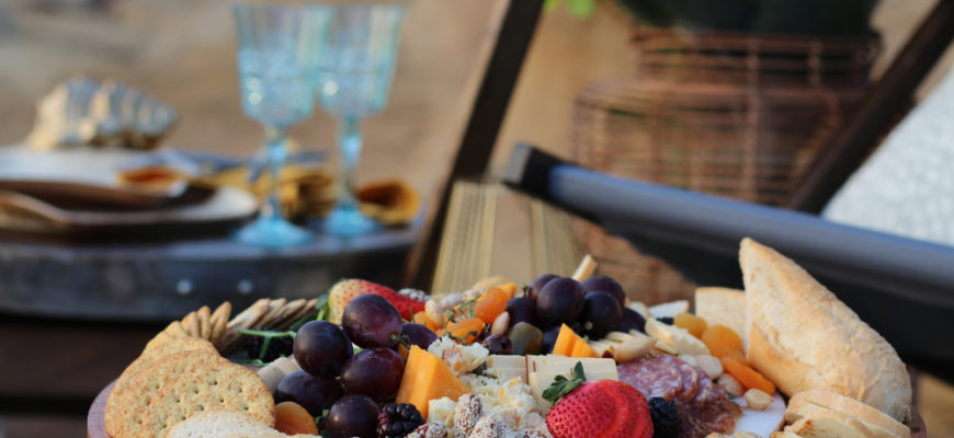 Luxury,Outdoor,Picnic,Party,Setup,With,Cheese,Board,,Wine,Glasses,